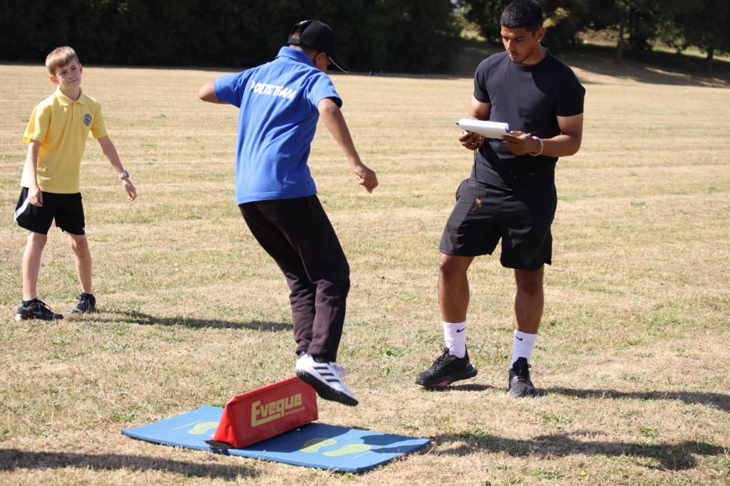 trust sports day at aletheia academies trust with rosherville doing speed jumps